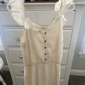Cream gauze midi dress with flutter sleeves, elastic waist, button top.